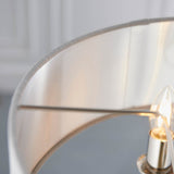 Close-up of Endon Brenley V1 3 Light Pendant showing the linen shade's brushed metallic inner lining, nickel frame arms, and a lit clear E14 candle bulb.