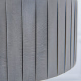 Close-up of the Brenley V2 3 Light Pendant's pleated grey linen fabric shade with nickel-toned trim, showing textured vertical fabric folds.