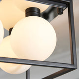 Close-up of Endon Sable semi-flush bathroom ceiling light showing matt black square frame with opal glass globe shades on G9 fittings.