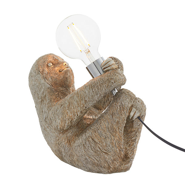 Endon Cliffmont table lamp with a detailed resin sloth in vintage silver finish, holding a chrome E27 lamp holder with an exposed globe bulb.