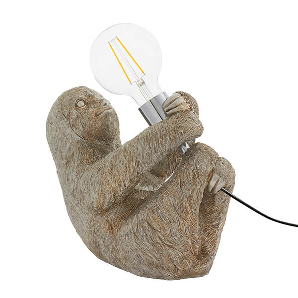 Endon Cliffmont table lamp with a vintage silver resin sloth holding a chrome E27 holder and exposed globe bulb, on a white background.