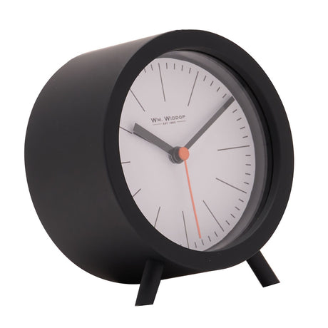 Round black plastic alarm clock with white dial, black hour markers, black hands, an orange sweep second hand, and two slim feet, shown on a plain background.