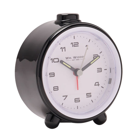 Round alarm clock with glossy black plastic case, white dial, bold Arabic numerals, grey and red hands, and a top snooze button, shown on a plain white background.
