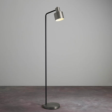 Endon Carlbourne industrial floor lamp with brushed silver cylindrical shade, matt black stem and silver disc base, shown against a plain light grey backdrop.