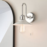 Cardew bathroom wall light with polished chrome swan-neck arm, gloss white coolie shade, exposed bulb, and pull cord switch, mounted beside a mirror.