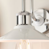 Cardew Bathroom Wall Light in polished chrome with a gloss white metal coolie shade, knurled detail, and swan-neck arm, shown close-up with wall mount visible.