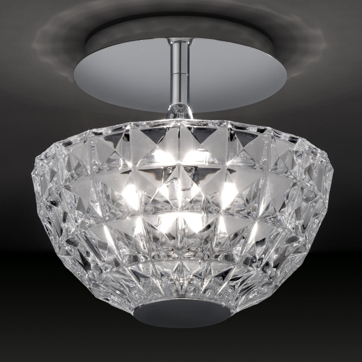 Deco Crystal Semi-Flush Ceiling Light in chrome, with a round ceiling plate, short stem, and a deep bowl of faceted clear crystal glass, shown against a dark background.