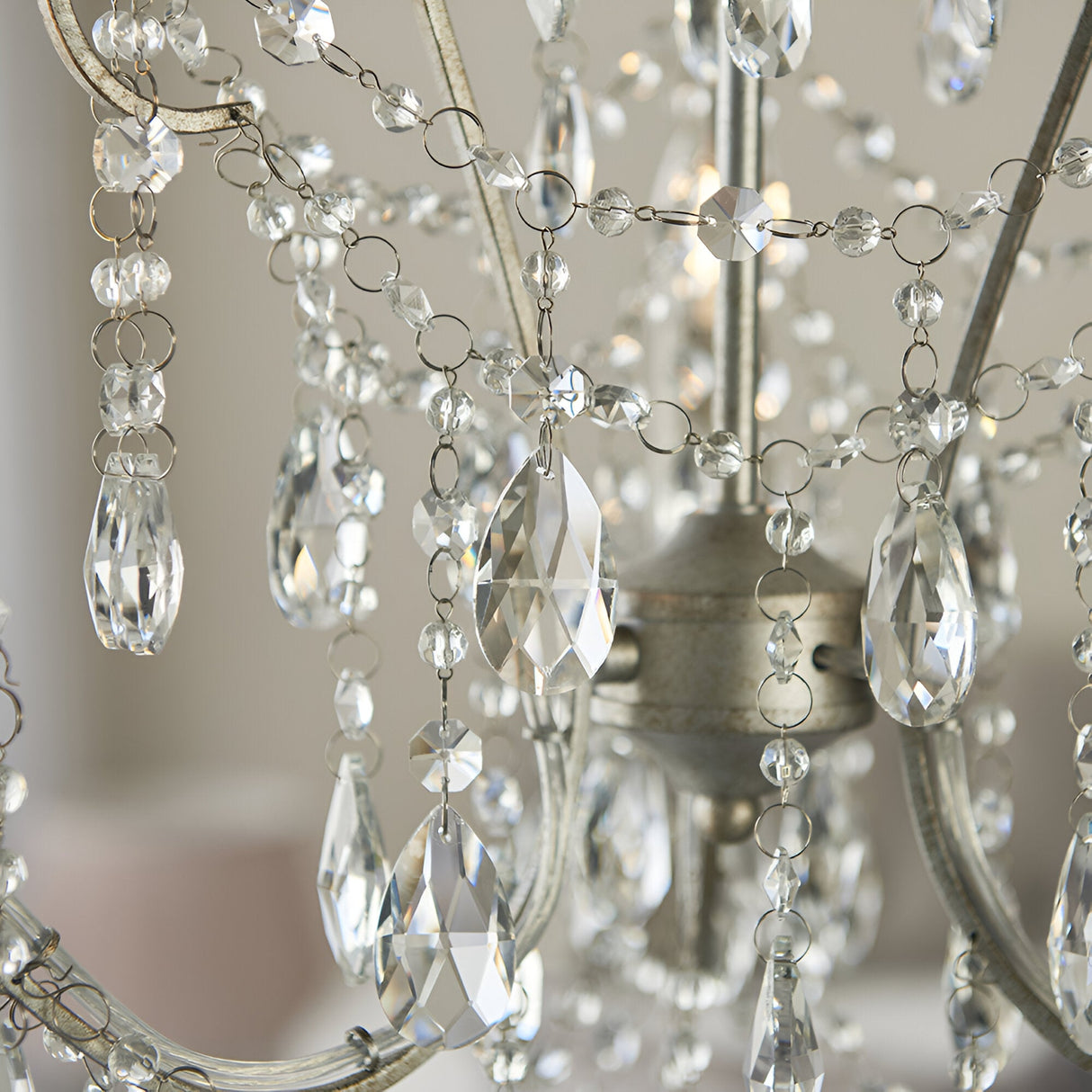 Close-up of Endon Aldwood 3 light pendant showing faceted cut crystal droplets and beaded strands on aged silver metalwork.