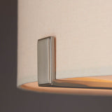Close-up of the Endon Brendon 3 Light Pendant showing the brushed nickel bracket securing the pale grey fabric shade, with the diffuser softly lit inside.