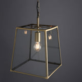 Endon Brenton tapered box lantern pendant in brass with clear glass panels, single E27 filament bulb, and black chain suspension on a grey background.