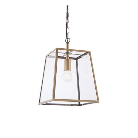 Endon Brenton lantern pendant in brass with tapered metal frame, clear glass panels and single E27 filament bulb, suspended from chain on white.