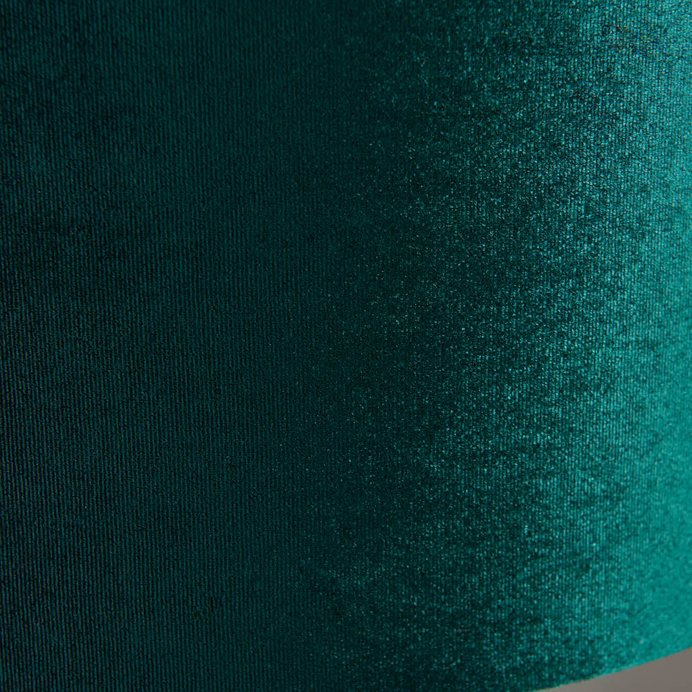 Close-up of the Brendon Table Lamp's green velvet shade, showing textured fabric weave in a rich emerald tone.