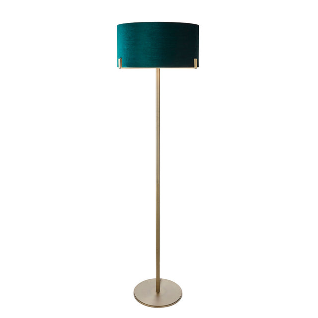 Endon Brendon floor lamp with a slim antique brass stem, round base, and green velvet cylinder shade held directly on the metalwork, on a white background.