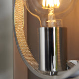Close-up of Endon Carlcombe chrome bathroom wall light showing faceted crystal ring detail and polished chrome holder with lit E27 globe bulb.