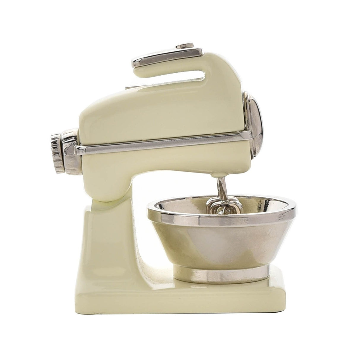 Miniature food mixer mantel clock in glossy beige metal with a silver mixing bowl, beaters, and chrome detailing, shown side-on against a plain white background.