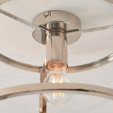 Close-up of the Endon Ellery flush ceiling light in brushed nickel, showing the E27 lamp holder, exposed bulb and curved metal frame supporting the shade.