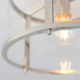 Close-up of the Endon Ellery Flush Ceiling Light in brushed nickel, showing the curved metal frame, glass shade edge, and illuminated E27 bulb inside.