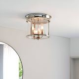 Endon Hollis 3 light flush ceiling light in nickel with cylindrical clear glass shade and three E14 candle lamps, mounted on a white ceiling.