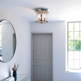 Endon Hollis 3 Light flush ceiling light in nickel with clear glass shade, mounted in a bright hallway with round mirror and grey front door.