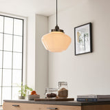 Endon Kedleston pendant light with rounded opal glass shade and polished nickel fitting, hung in a bright kitchen above a counter with jars and books.