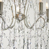 Close-up of the Endon Aldwood 5 light pendant showing aged silver scrolled arms, candle-style holders and faceted cut crystal droplets with beaded strands.