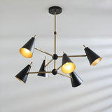 Brackwick 6 Light Pendant with matt black cone shades on brass arms and stem, adjustable angles, shown against a plain light background.