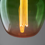 Close-up of Endon 2.8W E27 LED filament bulb with green-to-pink ombre glass, glowing warm white at 1800K over an etched acrylic diffuser sleeve.