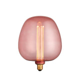 Pink-tinted E27 LED filament bulb with tall visible filament and brass cap, shown on a plain white background.
