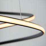 Close-up of the Endon Halden pendant light showing its textured black frame, curved white LED diffuser, and clear suspension flex against a grey background.
