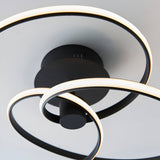 Endon Halden semi-flush ceiling light in matt black metal, shown from below with looping LED bands around a round backplate on a white ceiling.