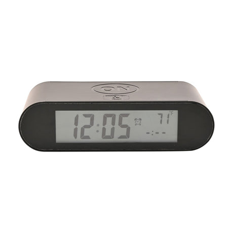 Black plastic oval alarm clock with LCD display showing time and temperature, top-mounted ON button and SNOOZE/LIGHT touch pad, shown on a white background.