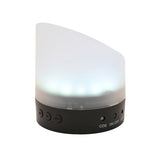 Flip alarm clock with black plastic base and frosted clear plastic shade glowing as a bedside light, shown upright with CDS, ON/OFF and LED buttons on a white background.