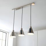Endon Brackley 3 Light Linear Pendant in nickel with satin white inner shades, cone-shaped lamps on black flex, installed above a bright kitchen.