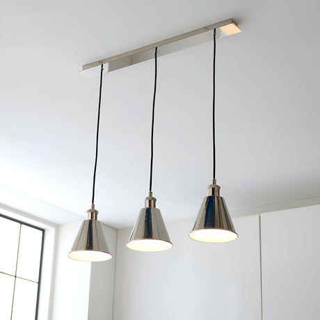 Endon Brackley 3 Light Linear Pendant in nickel with satin white inner shades, cone-shaped lamps on black flex, installed above a bright kitchen.