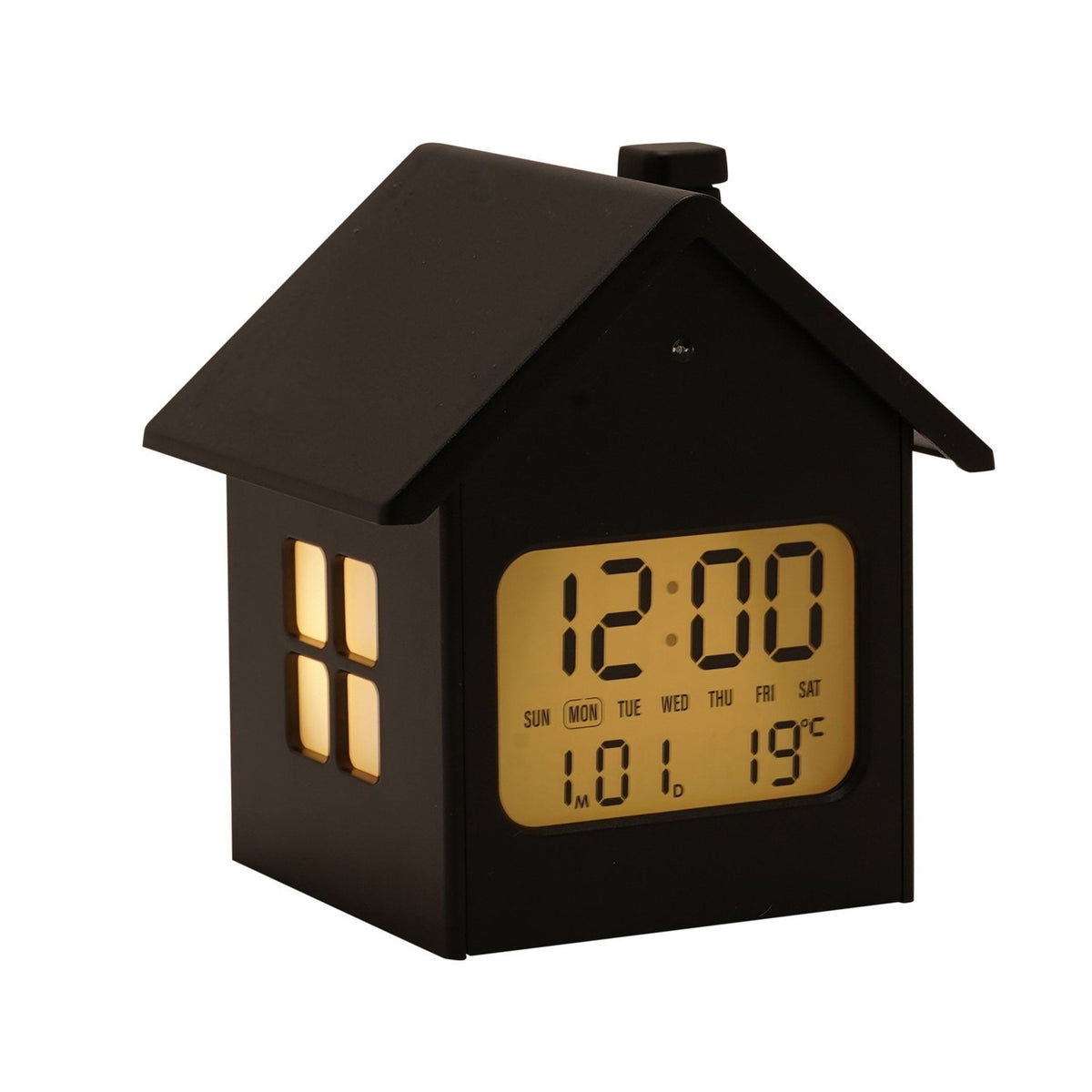 House-shaped digital alarm clock in black with pitched roof, chimney, lit window panes, and front LCD screen showing time, day, date, and temperature on a white background.