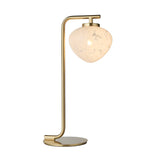 Endon Calloway table lamp in satin brass with a slim upright arm and white confetti blown glass shade on a round base, plain white background.