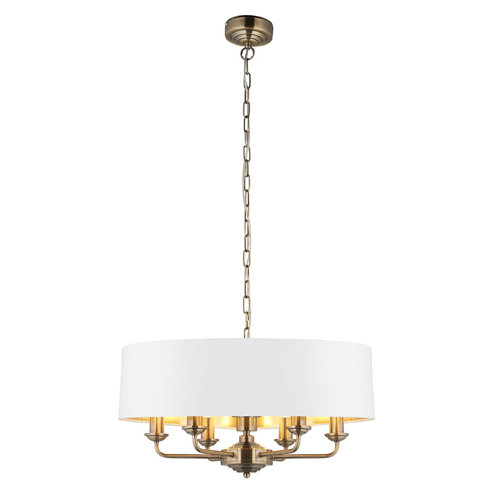 Endon Brenley V1 six-light pendant with a wide white drum shade, gold-lined interior and antique brass arms on a chain, shown on a white background.