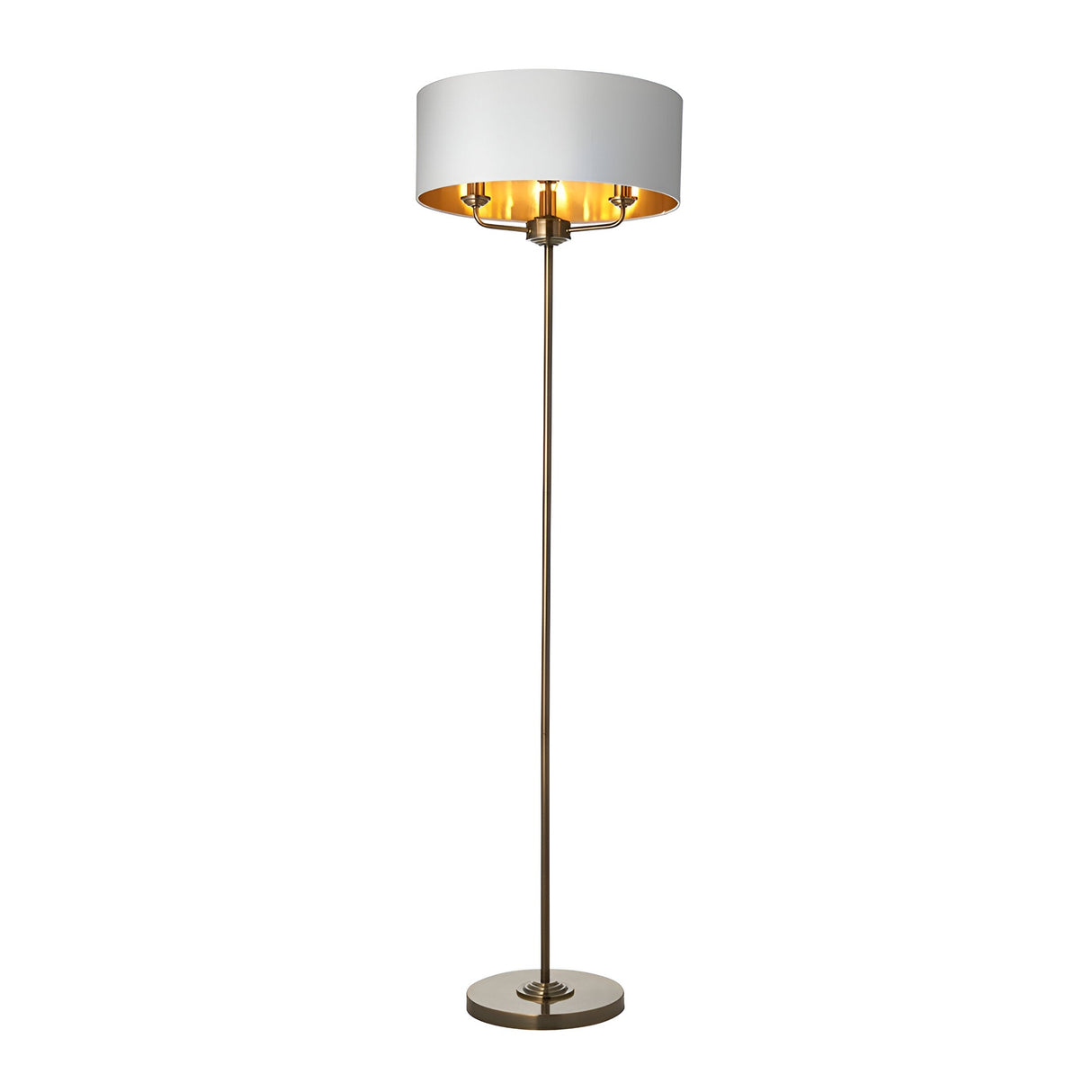 Endon Brenley 3 light floor lamp with wide white fabric shade, gold metallic inner lining and slim antique brass stem on a round base.