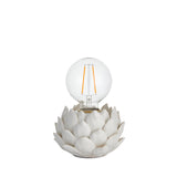 Aldgrove Table Lamp in white ceramic with a sculpted artichoke-shaped base and antique brass neck detail, shown with an E27 globe bulb on a plain background.