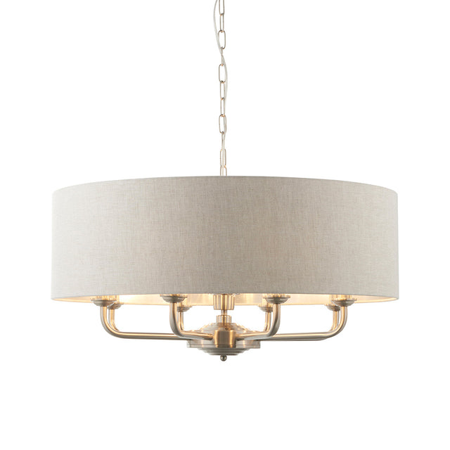 Endon Brenley 8 light pendant with natural linen drum shade and brushed chrome multi-arm frame on a chain suspension, shown on a white background.