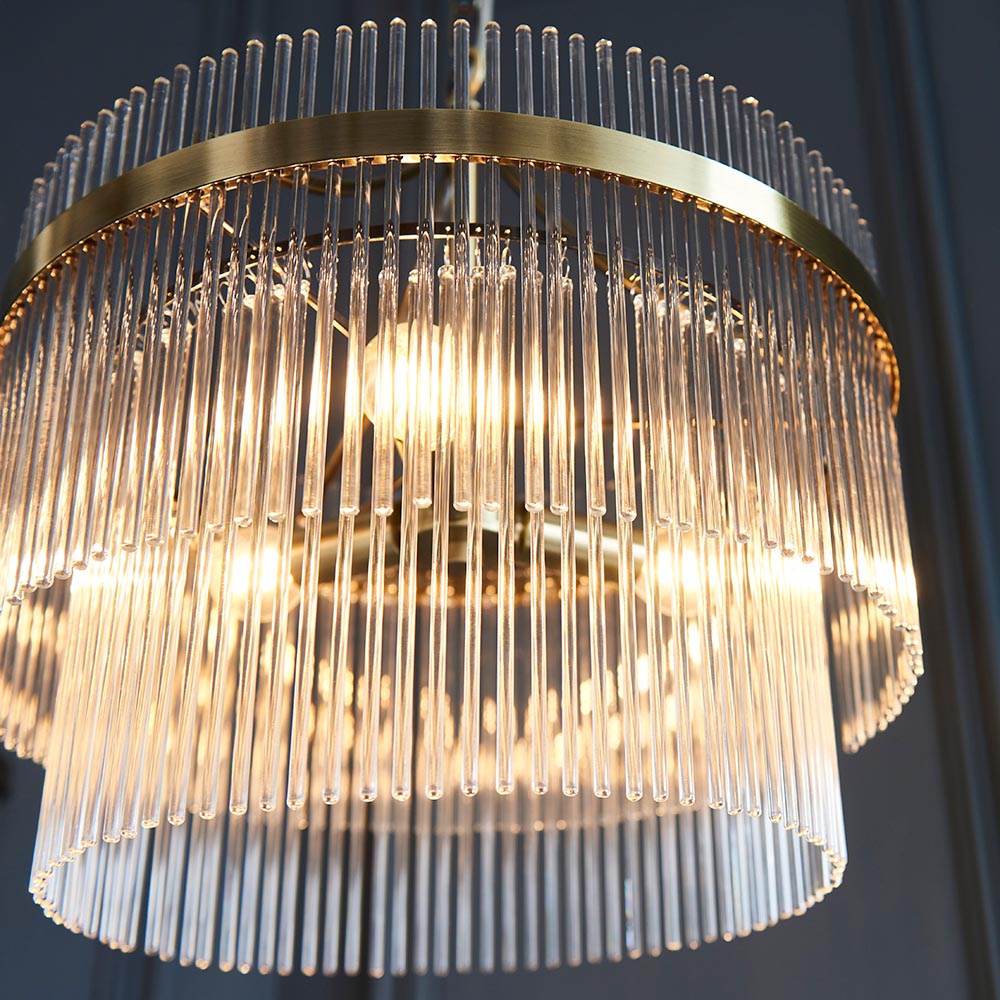 Endon Beaumont 3 Light Pendant in brass, close-up of the two-tier drum shade with clear glass rods and illuminated E14 lamps inside.