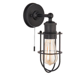 Bevwood industrial-style bathroom wall light in black metal with wire cage shade, pull-cord switch and E27 filament bulb, on a white background.