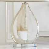 Brockstead Table Lamp with gold-tinted dimpled teardrop glass body on a chrome base, shown close-up beneath an oval mink fabric shade.