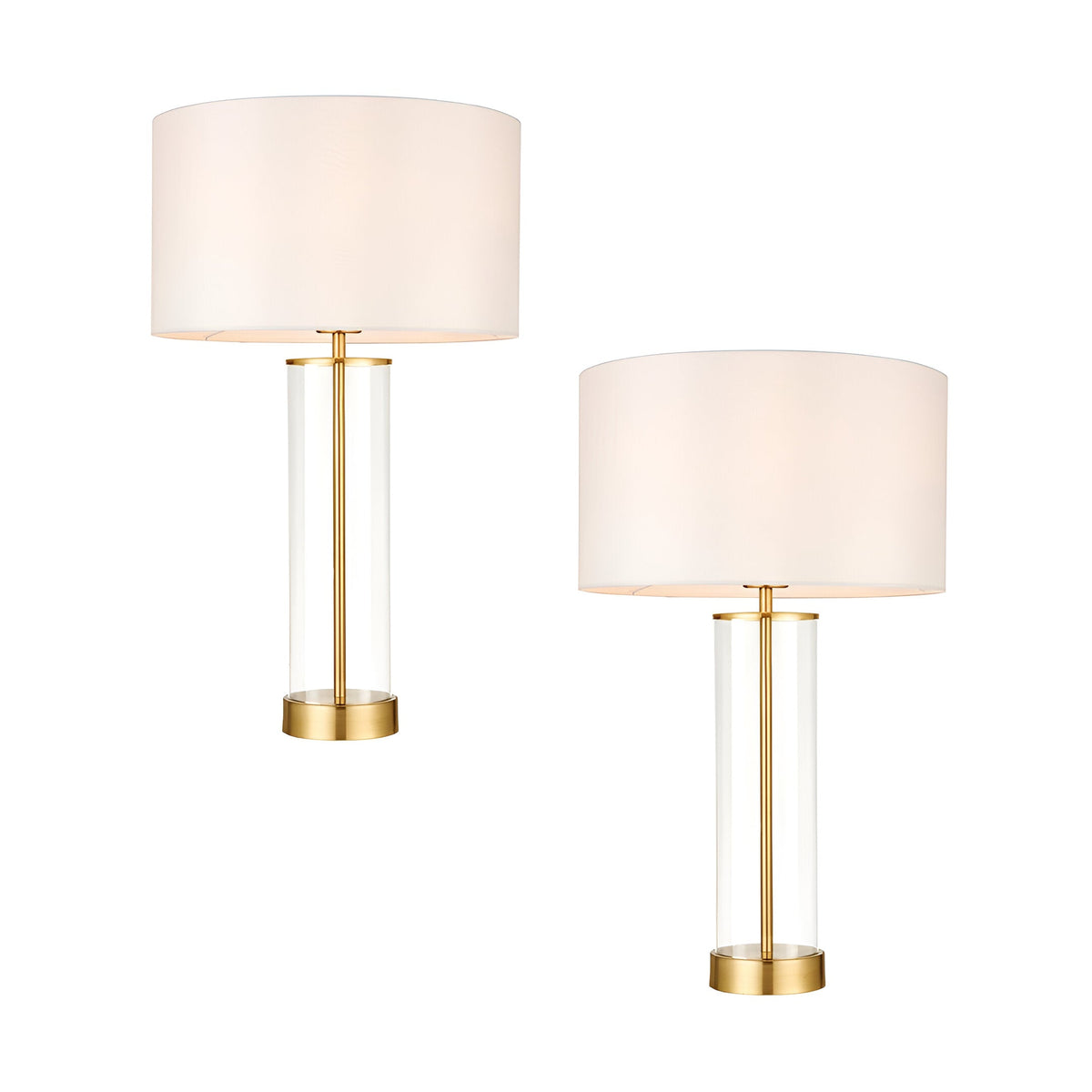 Endon Caldley twin pack table lamps with clear cylindrical glass bases, satin brass fittings and vintage white drum shades, shown on a plain background.