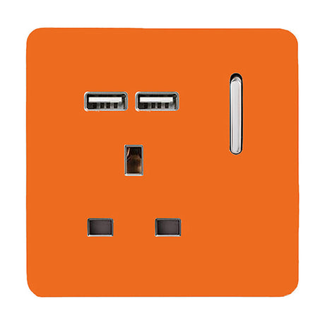 Single 13A switched socket in orange with a screwless plate, chrome switch rocker, single UK pin socket, and two USB-A charging ports, shown on a plain white background.