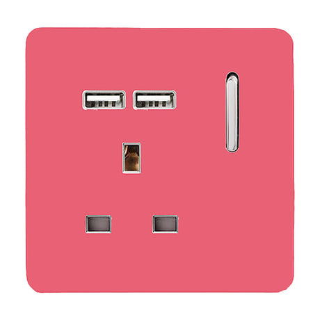 Single 13A switched socket in strawberry pink with a screwless square plate, chrome-framed socket, two USB-A charging ports, and a chrome rocker switch, shown on a plain white background.