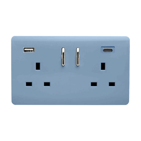 Sky blue screwless double socket with two 13A switched outlets, chrome rocker switches, and integrated USB-A and USB-C charging ports, shown on a plain white background.