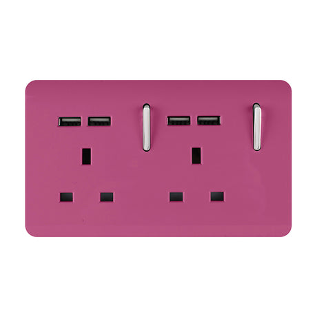 Pink double 13A socket with screwless plate, chrome-trimmed rocker switches and four USB-A ports, shown on a plain white background.