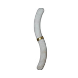 The Aureli LED Curved Alabaster Wall Light features a soft white, S-shaped design with a smooth surface and a brushed brass band at its center, showcased against a plain white background.