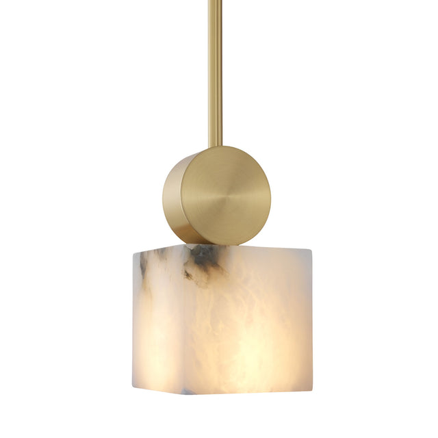 The Serano 1 Light Small Vertical Pillar Alabaster Pendant features a brass rod, a circular mount, and a glowing cube-shaped alabaster shade in soft white with gray marbling—an elegant update on the classic vertical pendant.